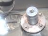 Use a 30mm, 6-sided regular socket to remove the pinion nut (avoid the 12-point sockets - too easy to strip the nut and impact sockets are often too thick to fit down around the nut - and if you have a VW, this is the same size as the front axle nut), count the number of turns needed to remove it and reinstall with the same number to retain the pinion bearing pre-load.
