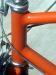 Here is a closeup of the <a href=http://www.sheldonbrown.com/schwinn-braze.html>hand-made fillet brazed head tube on the frame</a>.  It is made of straight gauge 4130 cromoly steel tubing.  Bike weight came in around 31 lbs. with the pump and 2 water bottle holders, probably 30 lbs. stripped.  In stock form I think it ran 33 lbs. according to the catalog scans, but I recall it ran a few lbs. more than that.