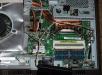This is a close up showing the memory slot (I added an 8GB DDR3 laptop SO-DIMM to bring the total RAM to 12GB).  Also visible is the small plug-in card and the impressive copper heat pipe cooling system on the CPU (mine is Core i3-3220), and a few of the other components.