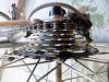 Similar shot of what I had to do to fit a 13-28 7-sp. freewheel on my Raleigh Competition frame, similar grinding and spacer.  Not too bad for an original 120mm frame and rear hub!